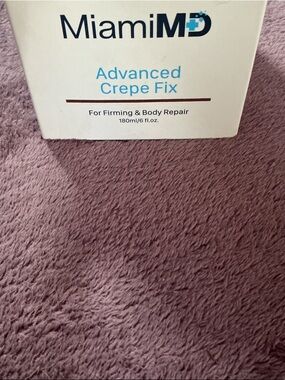 miami Advanced Crepe Fix Cream in White with Blue Accents